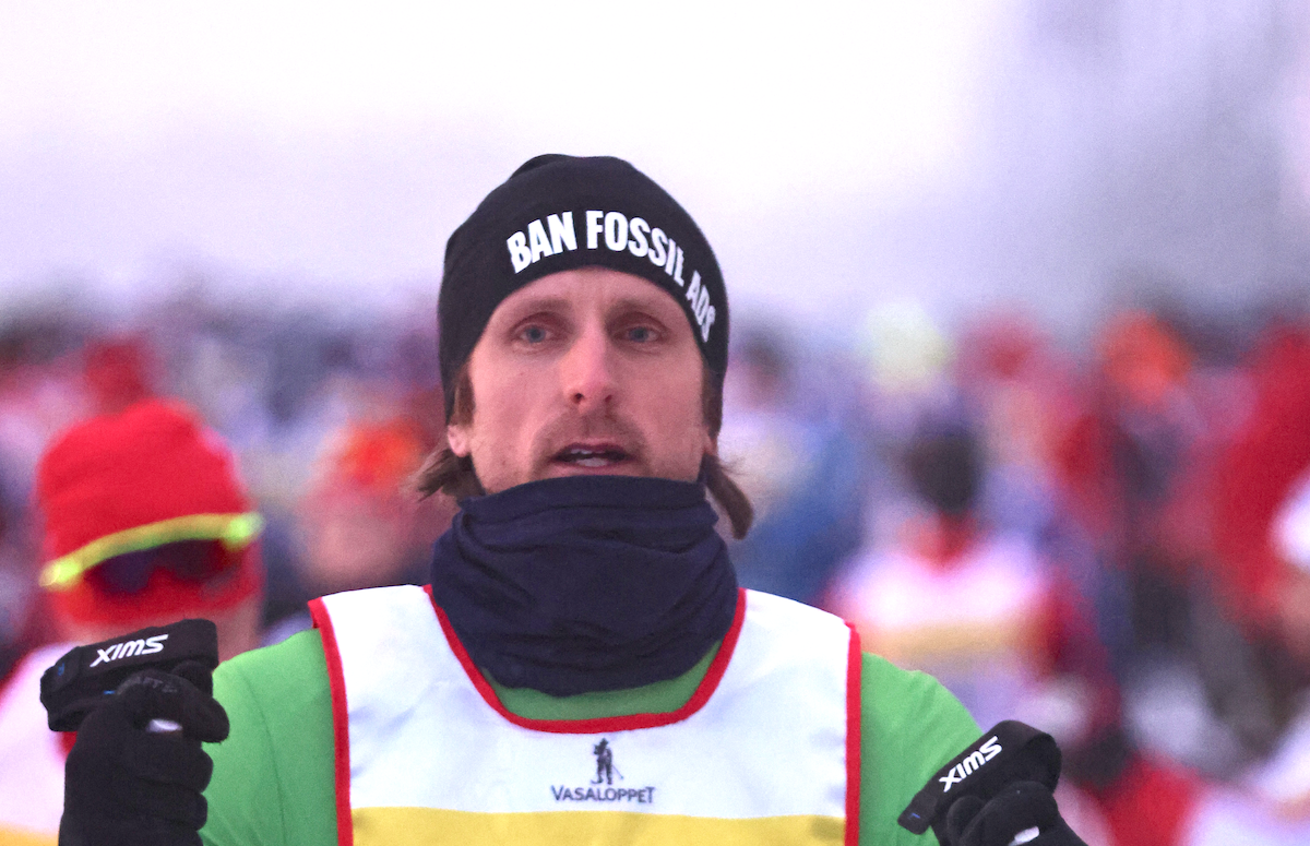 Curler delivering a stone on the ice